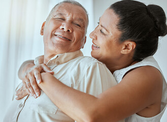 Retirement couple, love and hug in home for romance, relax and smile in Colombia living room together. Happy elderly man, senior woman or pension people marriage, happiness and care of easy lifestyle