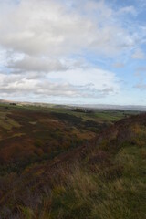 Fototapeta premium Countryside views from the top of a mountain with rural farmland and far reaching views. Taken in Bury Lancashire England. 