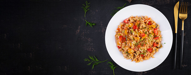 Tomato rice with vegetables and chicken. Healthy food. Healthy lifestyle. Top view, banner
