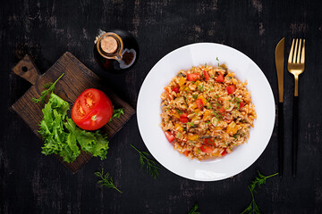 Tomato rice with vegetables and chicken. Healthy food. Healthy lifestyle. Top view, overhead