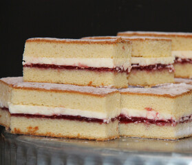 A Pile of Freshly Baked Victoria Sponge Cake.
