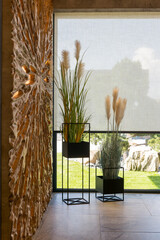 Roller blinds in the interior close up. Automatic solar shades large size on the window. Modern...