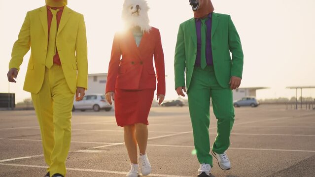 cinematic and storytelling video of a group of friends having fun and celebrating outdoor wearing funny mascots costumes