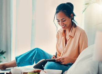 Woman writing in notebook, journal or dairy with pen planning, goal or idea in bed. Happy creative,...