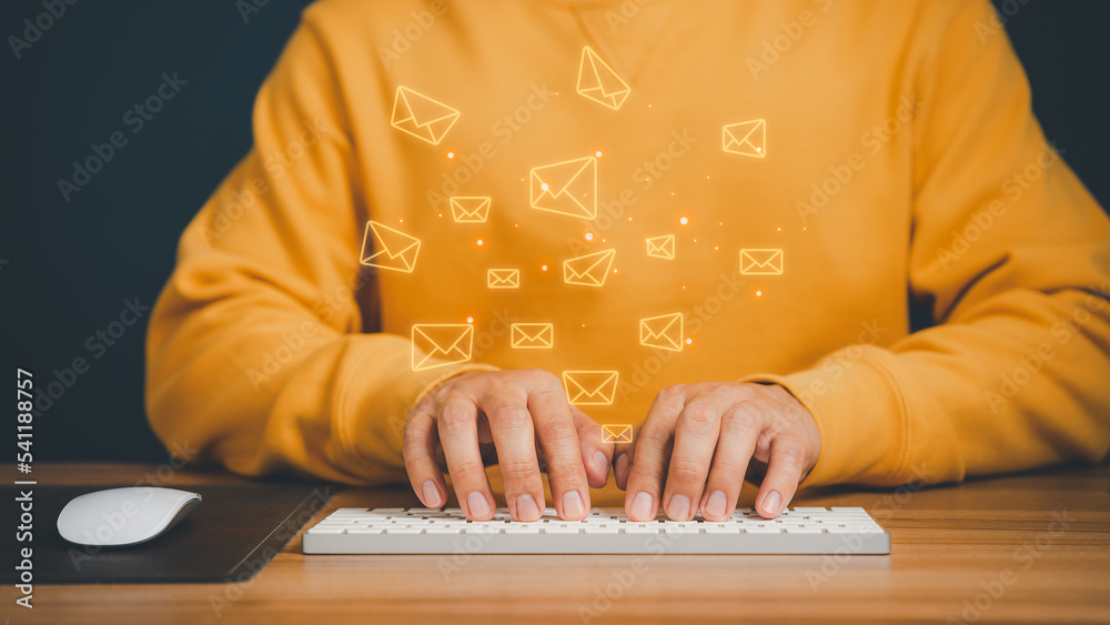 Poster Email Marketing and Newsletters, Technology and lifestyle concepts. Man's hand using computer keyboard and sending online message with email icon.