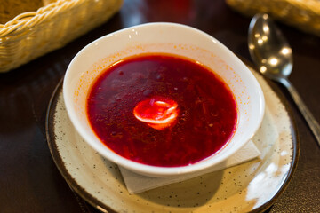 traditional ukrainian beetroot soup with sour cream in a bowl