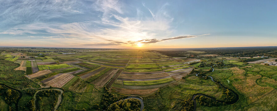 The valley of the lower Tanew river during sunset - panoramic view from drone - August 2020, Poland