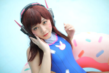 Portrait of Japan anime cosplay girl with swim suit at swimming pool