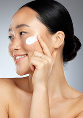 Korean skincare, happy and face skin cream of a woman with a smile using lotion. Happiness of a...