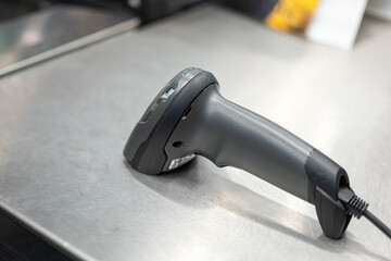 A digital qr bar code scaning for payment product placed on supermarket cashier counter service. Bunisess and technology object equipment. Close-up.