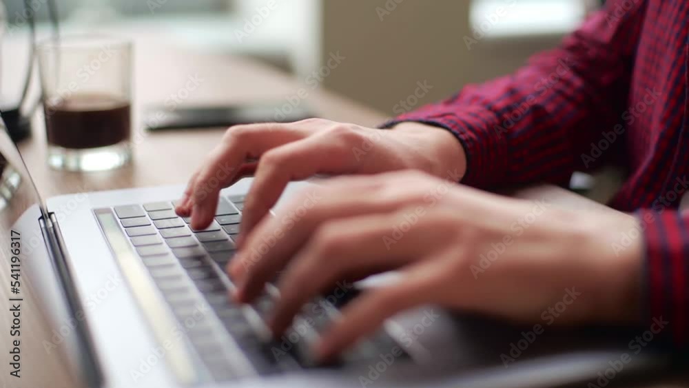 Wall mural close up of freelancer's developer hands typing program code on laptop keyboard in coworking. busine