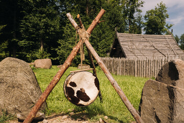 An old traditional drum with fur hanging in a medieval village