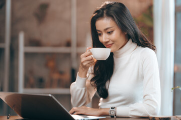 portrait of young business entrepreneur woman lifestyle, professional freelance businesswoman having smile and happy to work using computer laptop on online cyberspace technology, Asian beautiful girl