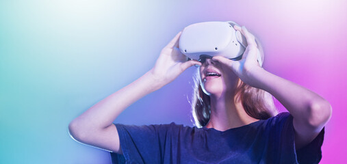 VR, metaverse and woman with glasses against a neon mockup background. Virtual reality, gaming and...