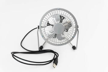 Small usb fan for table. Silver color. White background.