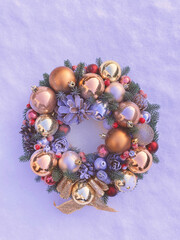 Christmas decorative wreath with pine cones, Christmas tree golden balls and ornaments on a...