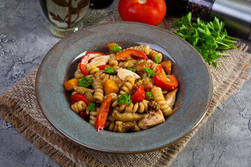 Pasta with fried chicken, mushrooms, pepper and pumpkin
