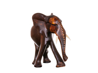 Wooden figurine in the shape of a carved brown wood elephant. Items for decoration, gifts. Decor in...