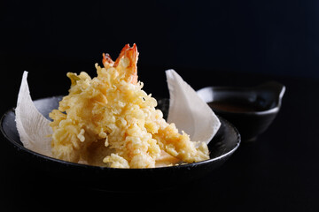 Shrimp tempura Japanese food isolated on a black background