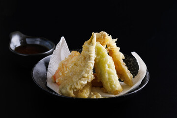 Mix tempura with shrimp fish and vegetable Japanese food isolated in black background - 541199798