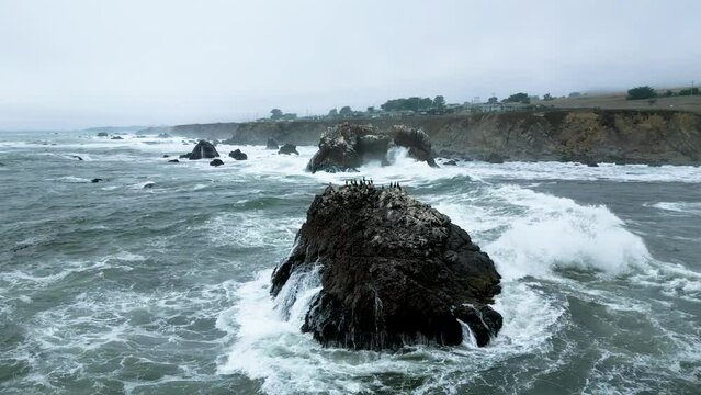 Stormy waves crash along Arched Rock in Sonoma County Bodega Bay along Pacific Highway 1 Coast, California