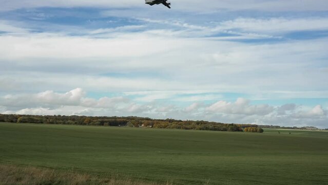 ZM409 RAF Royal Air Force Airbus A400M Atlas military cargo airplane on a low level run preparing to drop several large containers by parachute