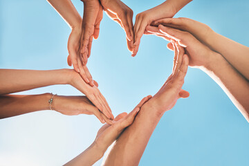 Heart, love and group hands for support, care and community with outdoor summer sunshine, blue sky...