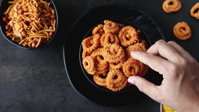 Rice murukku savoury Arisi murukku chakli chakali Pongal festival snack deep fried coconut oil traditional South Indian chennai Tamil Nadu India Kerala Sri Lanka, Onam, Vishu, Diwali Makar Sankranti.