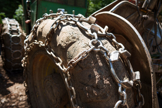 Traction chains on the big wheel of a forest log truck