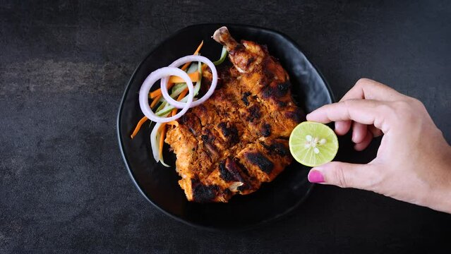 Alfaham Chicken , Arabian spicy food tandoori whole chicken Bengaluru, India . Platter served with salads. Al Faham Charcoal Grilled Chicken in India . 4k video footage.