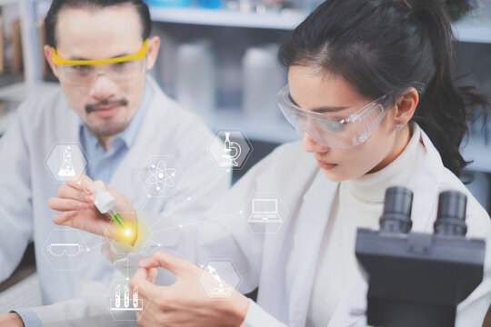 Concept of biology, eco or natural cosmetic laboratory with icon, vector, sign or symbol and graphic. Asain Female scientist is focusing and looking while dropping green substance. Science background.