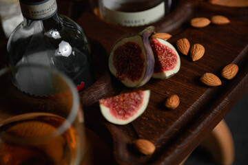 Fresh sliced fig with almond on a wooden board