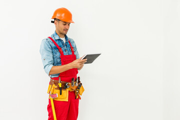 Fototapeta premium Construction Worker with a tablet. Planning Developer Concept
