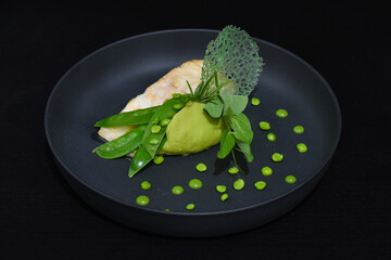 Fresh perch fish fillet on pea puree with quinoa and herbs