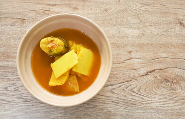 boiled barracuda fish with pickled bamboo shoot in spicy and sour soup on bowl 