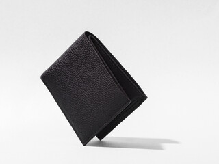 Leather wallet on background. With credit card inside. - obrazy, fototapety, plakaty