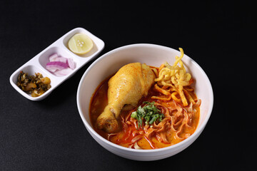 Khao Soi Thai Curry soup isolated in black background