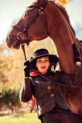 Girl in a hat on a horse