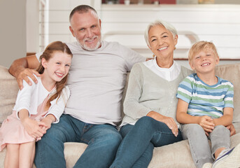 Grandparents, grandkids and being happy to relax and smile together on sofa in living room. Portrait, grandfather and grandmother with grandchildren for love, bonding and happiness on couch as family - obrazy, fototapety, plakaty