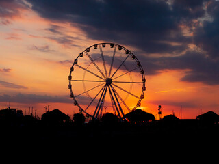 Silhouette of the ferris wheel at sunset - Rimini, Italy