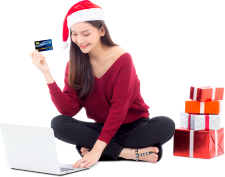 Young woman gift box sitting labtop with internet shopping and holding credit card christmas holiday, girl shoping online on notebook in xmas, celebration concept.
