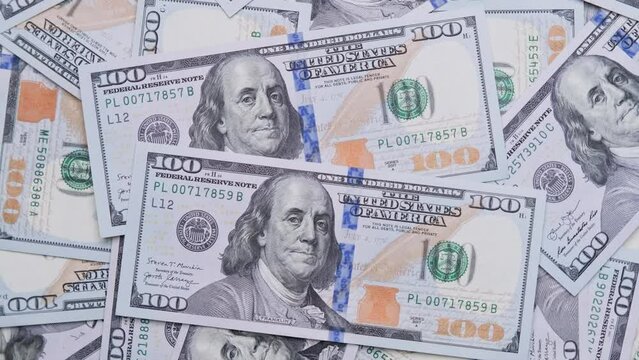 Counting money. Pile of american dollars. Dollar banknotes appearing one by one. New hundred dollar bills. Inflation and deflation concept. Hundreds usd. Money pattern. Close-up in 4K