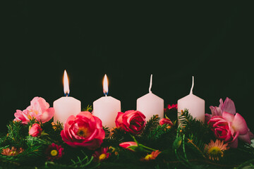 advent wreath with four candles, two candles burning