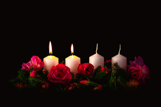 advent wreath with four candles, two candles burning