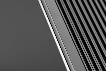 Abstract close up on a computer case. Strong line, flat aspect. 