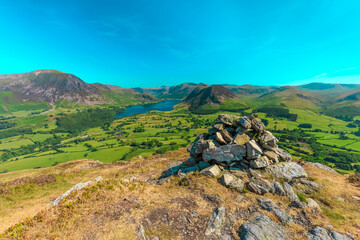 Low Fell Cairn overlooking Crummock Water, The Lake District, Cumbria, England	
