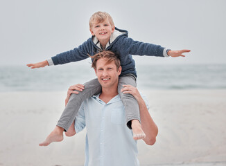 Child, dad and piggy back on beach on a family holiday ocean walk in Australia. Travel, fun and a portrait of happy father and son with smile playing on sea sand on vacation with open sky and waves.
