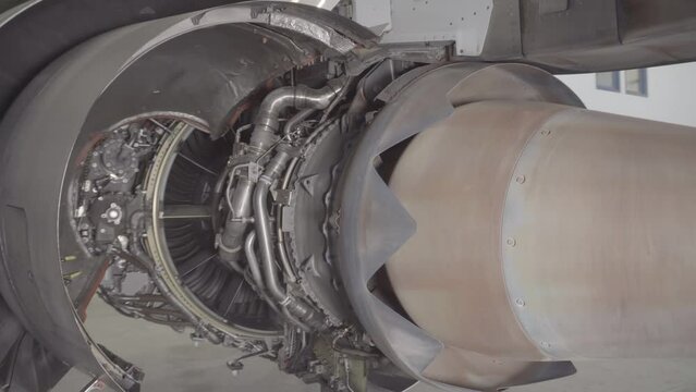 Aircraft engine in service. Passenger plane on regular service in the aircraft repair hangar