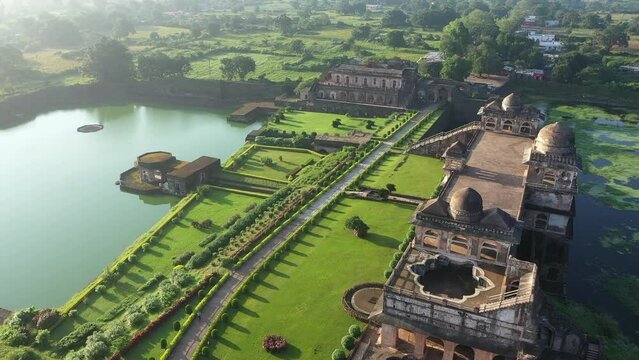 Drone view over the Mandav city ancient buildings and greenery on a sunny day