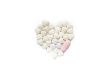 Fototapeta na wymiar Health concept with heart formed with small pills